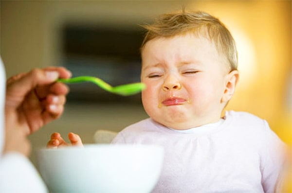 Why do children vomit after eating?